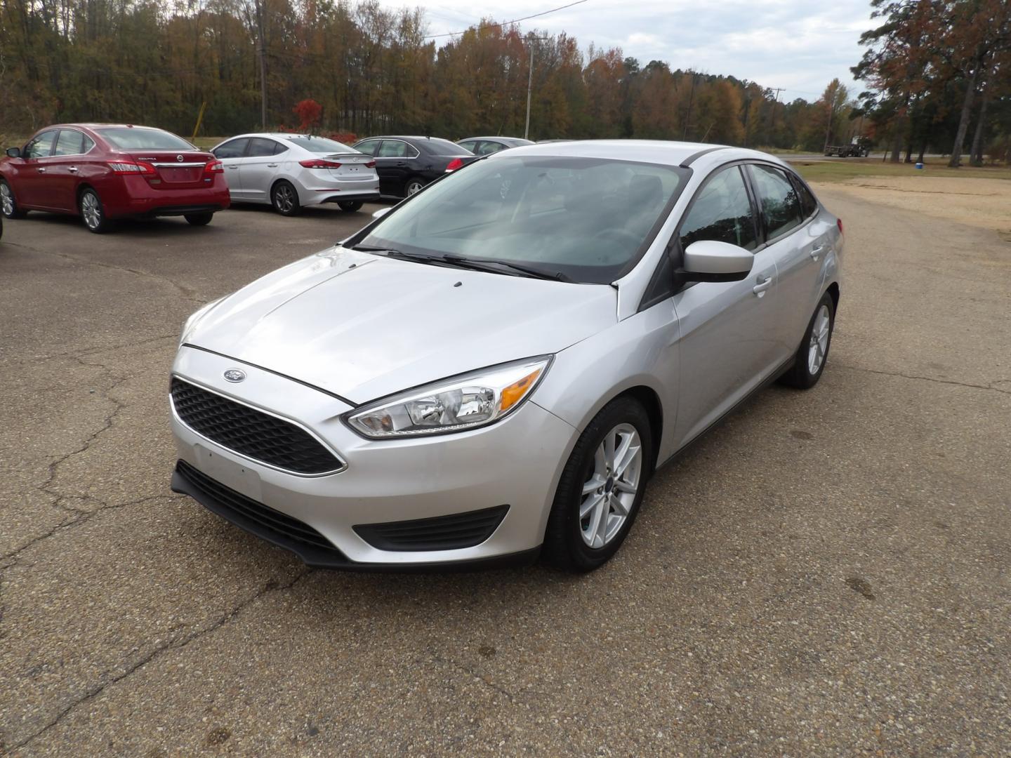 2018 Ingot Silver Metallic /Black Ford Focus SE (1FADP3FE4JL) with an 1.0L engine, automatic transmission, located at 401 First NE, Bearden, AR, 71720, (870) 687-3414, 33.726528, -92.611519 - Photo#0